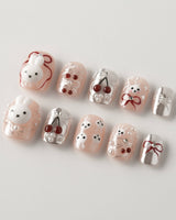 Miss Miffy extra short squoval press-on nails with nude base, rabbit and cherry details