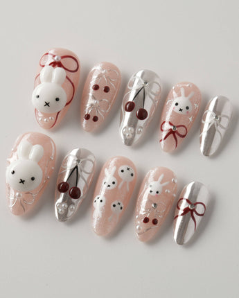 Miss Miffy medium almond press-on nails with silver metallic accents and 3D rabbit nail art