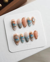 Monet Sunrise press-on nails close-up with loose impressionist strokes and glossy finish