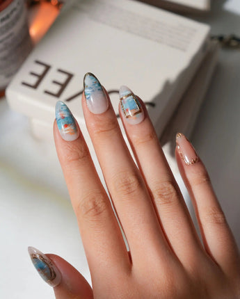 Monet Sunrise custom size press-on nails in short almond with hand-painted sunrise scene