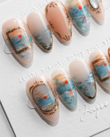 Monet Sunrise S press-on nails in short almond with impressionist blue brushstrokes
