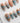 Monet Sunrise S press-on nails in short almond with impressionist blue brushstrokes