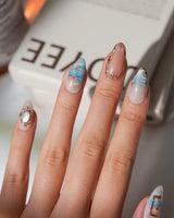 Monet Sunrise XS press-on nails in short almond with soft sky blue and sunrise details