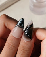 Monochrome press on nails mixing black and white marble, liquid chrome, polka dots, silver beads and a chrome bar across ten nails - image 4