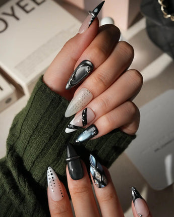 Monochrome press on nails mixing black and white marble, liquid chrome, polka dots, silver beads and a chrome bar across ten nails - image 5