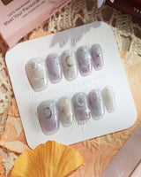 Moonrest starry press-on nails with moon design and soft sparkle-rich finish