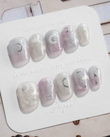 Moonrest pink white ombre press-on nails with silver celestial sparkle
