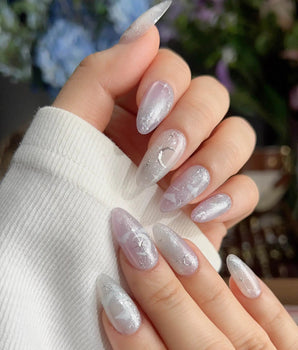 Moonrest medium almond nails with soft moonlit ombre and fine silver glitter