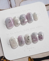 Moonrest glossy press-on nails with moonlit ombre and silver star details
