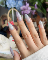 Moonrest close-up of pink white ombre, silver stars, and crescent moon detail