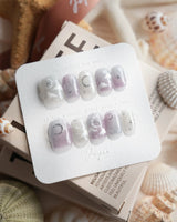Moonrest extra short square nails with soft ombre, silver stars, and moon design