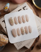 Morning Air press-on nails in medium oval shape — Fresh Creamy Nude, Hand-painted Metallic Daisies & Simple gold Wire.
