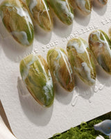 Mosses - Nightlight Moss nail art close-up showing Vintage Herbal Green, Marble Texture & Gold Foil Accents. details