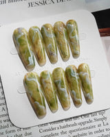 Mosses - Nightlight Moss press-on nails in long coffin shape — Vintage Herbal Green, Marble Texture & Gold Foil Accents.