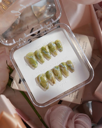 Mosses - Nightlight Moss press-on nails in short stiletto shape — Vintage Herbal Green, Marble Texture & Gold Foil Accents.