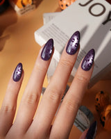 Mulberry leopard cat eye press on nails, cool plum base with a lilac shimmer band and hand-painted black leopard spots - image 1