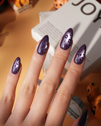 Mulberry leopard cat eye press on nails, cool plum base with a lilac shimmer band and hand-painted black leopard spots - image 1