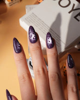 Mulberry leopard cat eye press on nails, cool plum base with a lilac shimmer band and hand-painted black leopard spots - image 5