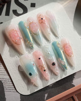 My Backyard press-on nails in long stiletto shape — Icy Multicolor, 3D Gold Wire Florals.