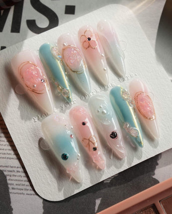 My Backyard press-on nails in long stiletto shape — Icy Multicolor, 3D Gold Wire Florals.