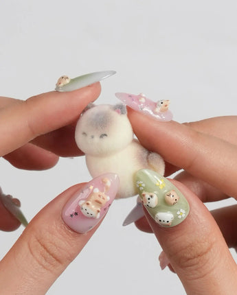My Lulu large short almond press-on nails with pastel character and glitter details