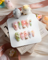 My Lulu handmade press-on nails with Lulu cat face and pastel 3D charms