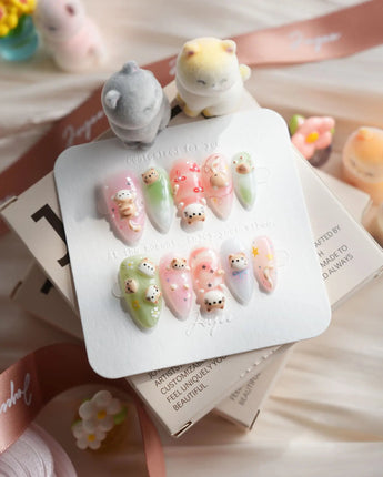 My Lulu handmade press-on nails with Lulu cat face and pastel 3D charms