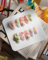 My Lulu extra short almond press-on nails with playful cat and cherry details
