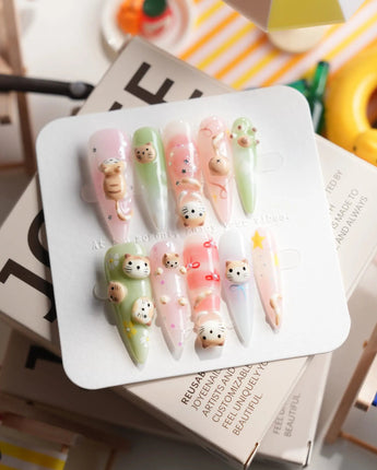 My Lulu long stiletto press-on nails with cat portrait and soft pastel accents