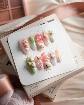 My Lulu medium almond press-on nails with pastel cat portrait nail art