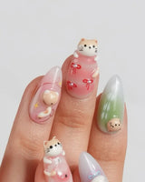 My Lulu short almond press-on nails with pastel cat portrait and glitter star details