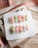 My Lulu short coffin press-on nails with pastel cat and 3D charm artwork