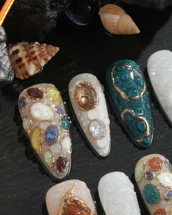 3D gem press-on nails with forest green and gold accents	