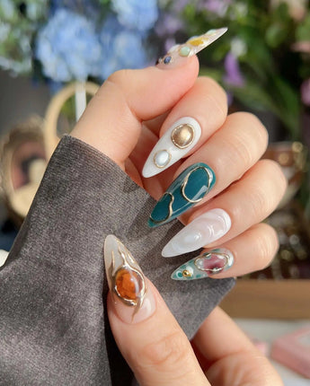 Duskwalk galaxy crystal nails with earthy green gems and dreamcore mineral texture