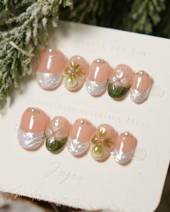 Duchess Olive nails with soft nude base, olive French tips, and sculpted flowers