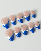 Navy blue French tip nails with a bold and elegant design.