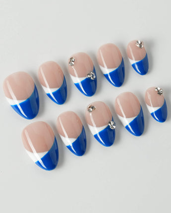 Navy blue French tip nails with a bold and elegant design.