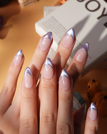 Nebula chrome French press on nails, nude base with a purple to blue to pink iridescent tip and a silver hand-drawn line - image 1