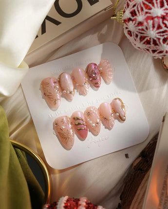 Neon Kiss press-on nails with luminous pink chrome, pearls and dimensional butterfly wing art