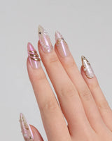 Neon Kiss press-on nails with glossy pink chrome, butterfly wing details and pearl accents