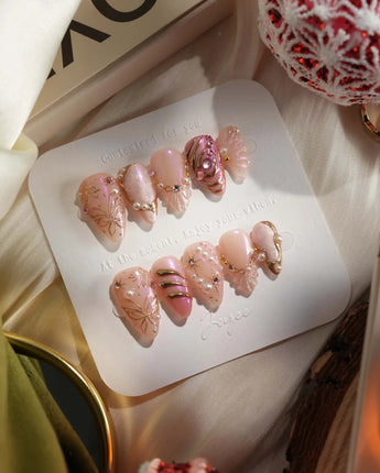 Neon Kiss press-on nails with sculpted butterfly wings, gold linework and pearly pink chrome
