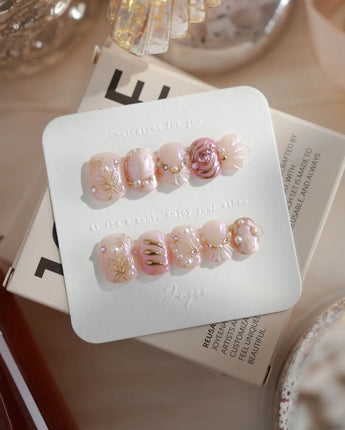 Neon Kiss extra short squoval press-on nails with pink chrome butterfly wings and gold lines