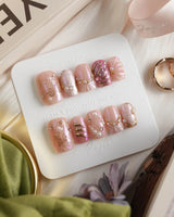 Neon Kiss short square press-on nails with pink chrome, pearls and butterfly wing details