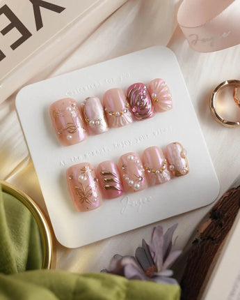Neon Kiss short square press-on nails with pink chrome, pearls and butterfly wing details