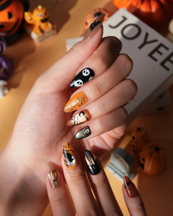 Nevermore press on nails with a black cat on a 3D copper pumpkin, a raven on a branch under an amber moon, ghosts and bats - image 4
