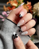 New Year Glam handmade press-on nails featuring Classic Black & White, 3D Bows & French Outlines.