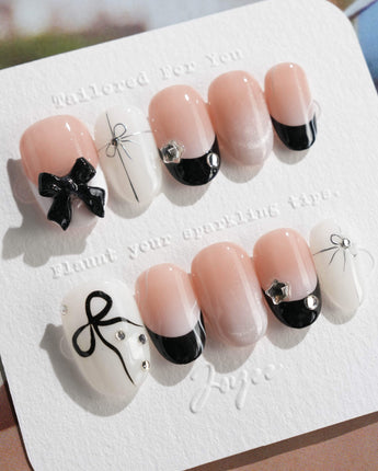 New Year Glam press-on nails in short oval shape — Classic Black & White, 3D Bows & French Outlines.