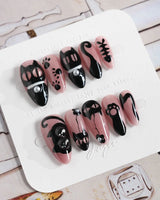 Night Prowler press-on nails in medium almond shape — dusty pink black cat hand-painted 3D details nails