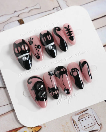 Night Prowler press-on nails in medium almond shape — dusty pink black cat hand-painted 3D details nails
