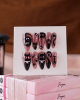 Night Prowler press-on nails in medium stiletto shape — dusty pink black cat hand-painted 3D details nails